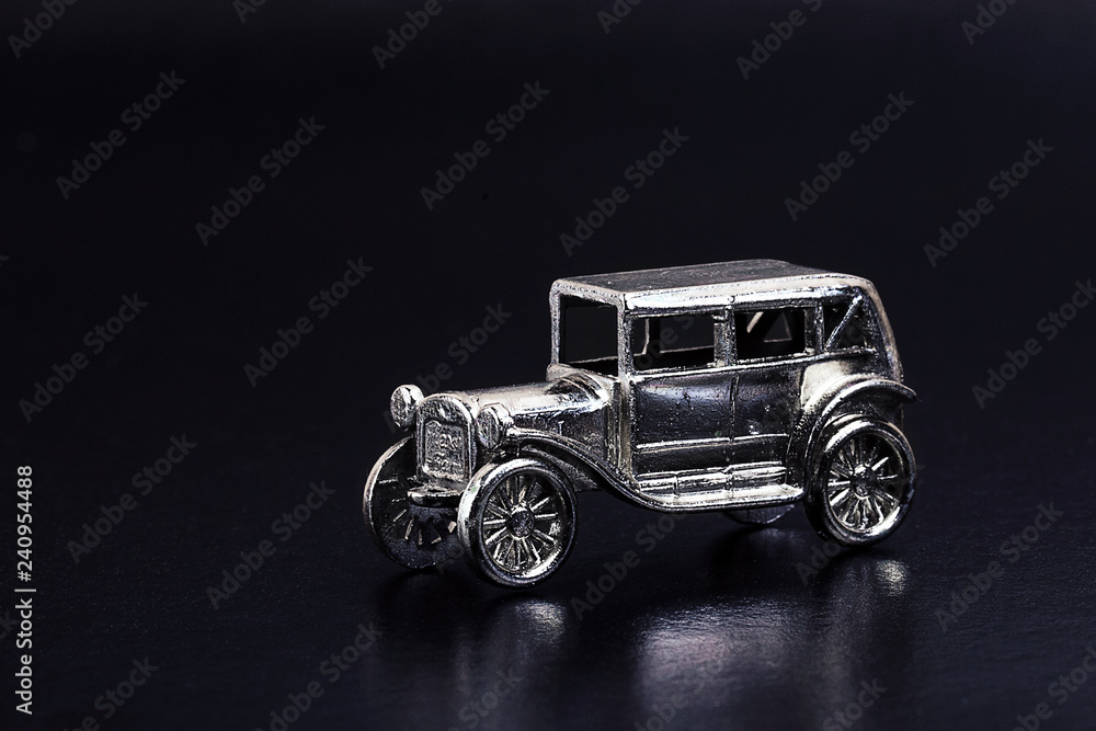 models of retro cars in miniature on a dark background models of retro cars in miniature on a dark background