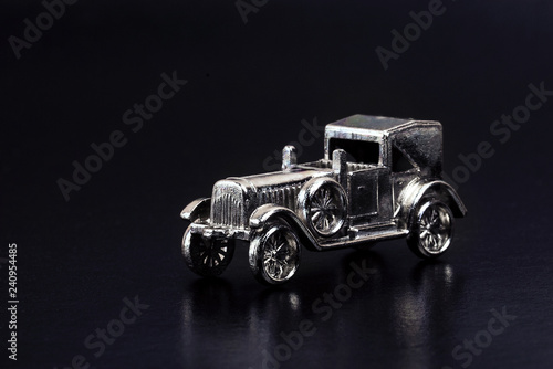 models of retro cars in miniature on a dark background