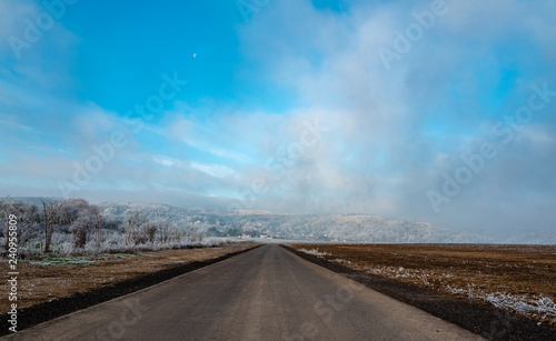 road and blue sky in winter