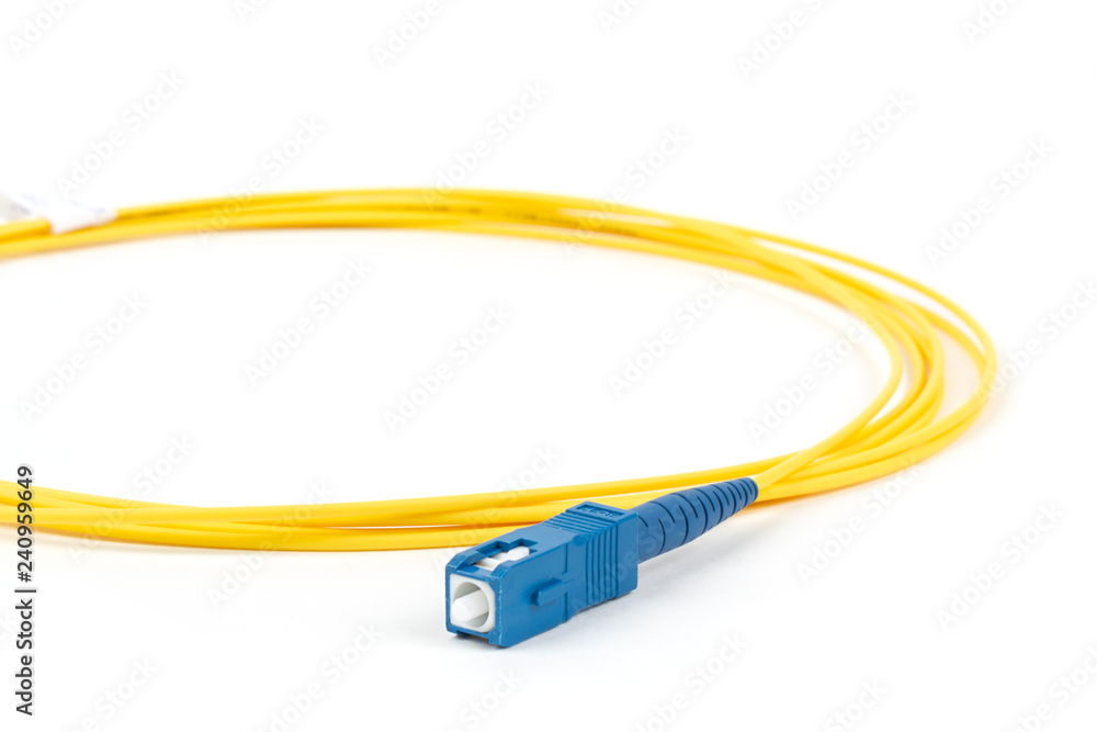 fiber optic single mode small form factor SC patch cord jumper with blue connector isolated on white background fiber optic single mode small form factor SC patch cord jumper with blue connector isolated on white background