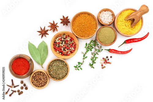 mix of spices in wooden bowl isolated on a white background with copy space for your text. Top view. Flat lay. Set or collection
