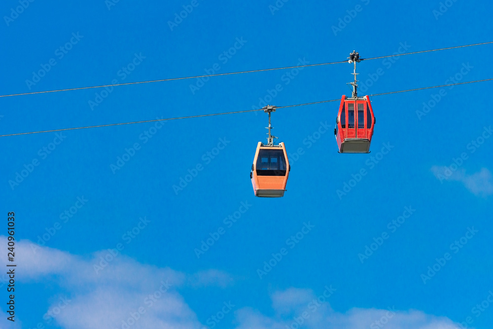 Cable car against the blue sky with clouds. Funicular. Cable car against the blue sky with clouds. Funicular.