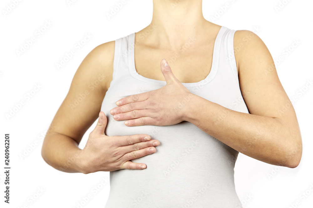 custom made wallpaper toronto digitalWoman white shirt examining her breast for lumps or signs of breast cancer