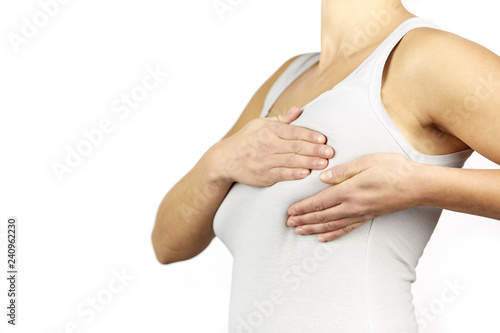 Wallpaper Mural Woman white shirt examining her breast for lumps or signs of breast cancer Torontodigital.ca