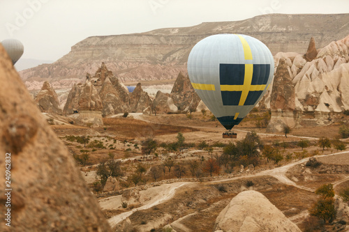 Travel. Hot Air Balloon Flying Above Rock Valley, Ballooning
