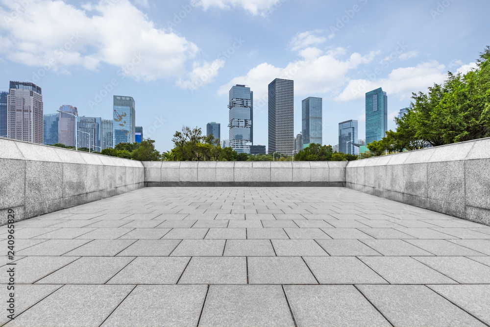Panoramic skyline and buildings with empty square floor.