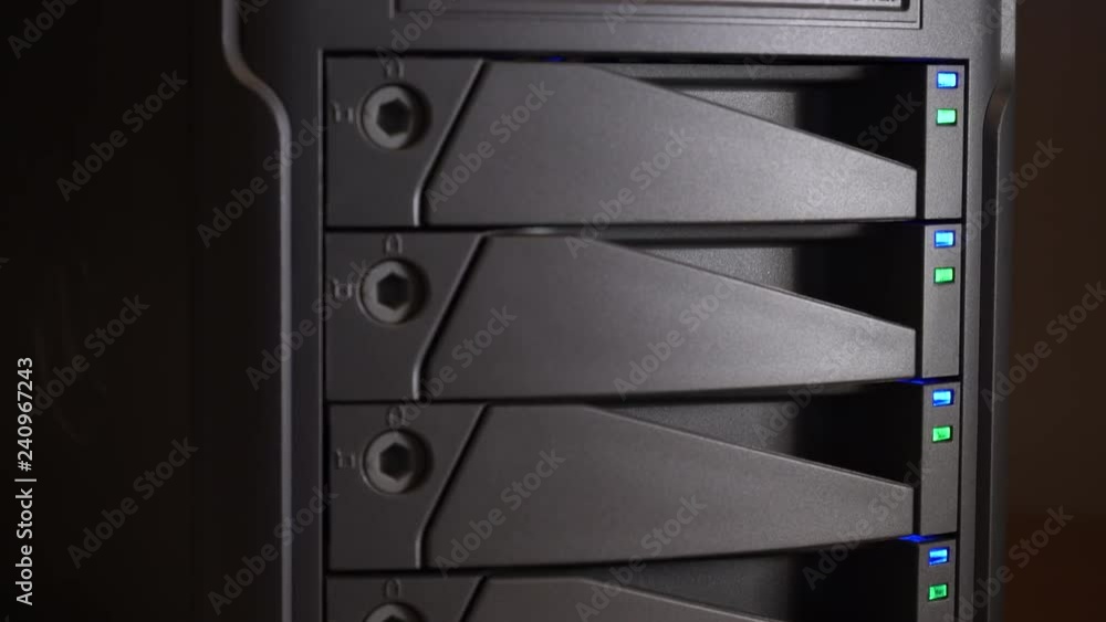 Hard drive array with blinking LED lights, vertical slider shot. Hard drive array with blinking LED lights, vertical slider shot.