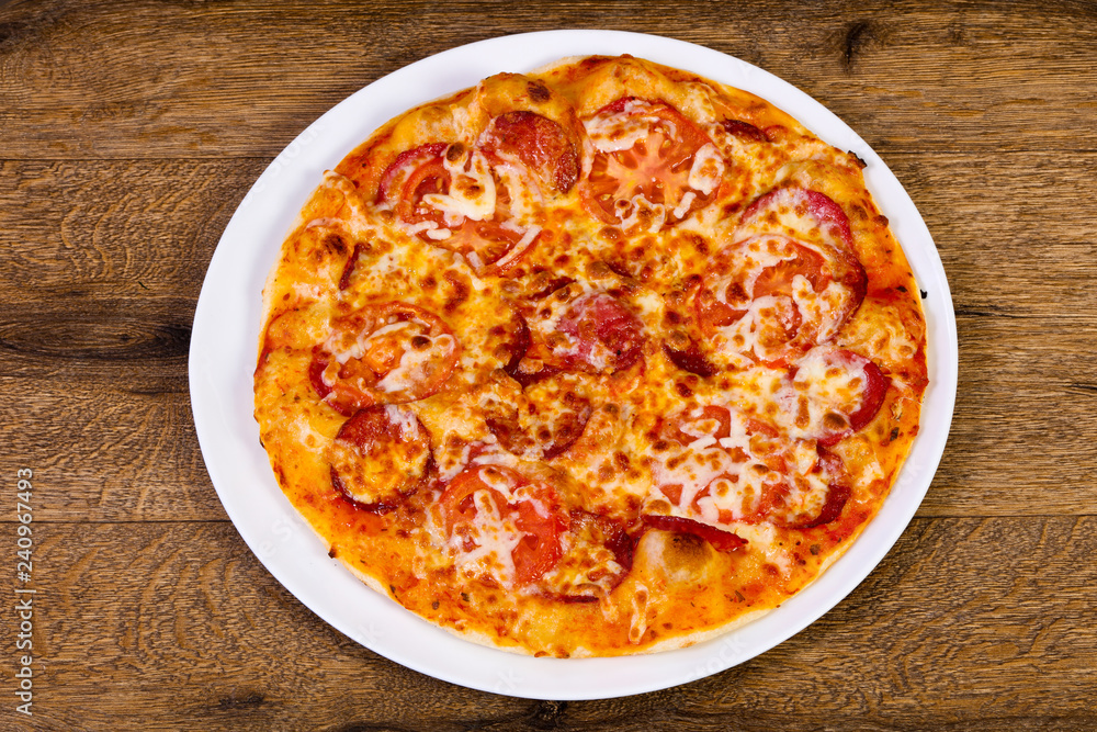 Pepperoni pizza with sausages