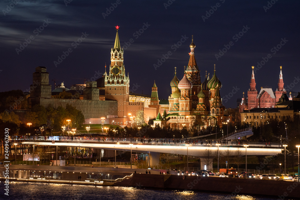 Night view of Moscow Kremlin and St. Basil's Cathedral with Soaring Bridge of Zaryadie park