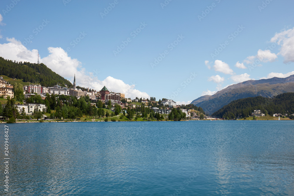 Sankt Moritz town and blue lake in a sunny summer day in Switzerland Sankt Moritz town and blue lake in a sunny summer day in Switzerland