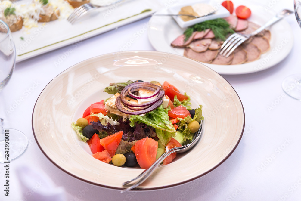 vegetable salad on a white plate on the table vegetable salad on a white plate on the table
