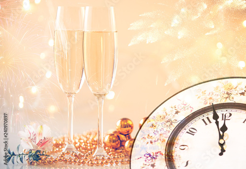 New Year Champagne glasses and fireworks background