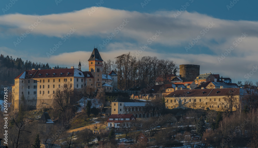Castle and town Vimperk in cold sunny evening