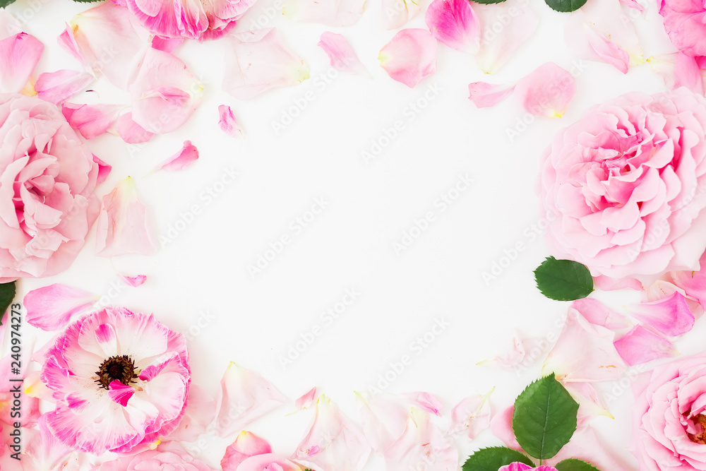 Floral frame with roses flowers and anemones on white background. Flat lay, top view. Pastel flowers