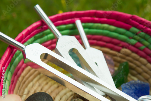 Hand holding a tuning fork .