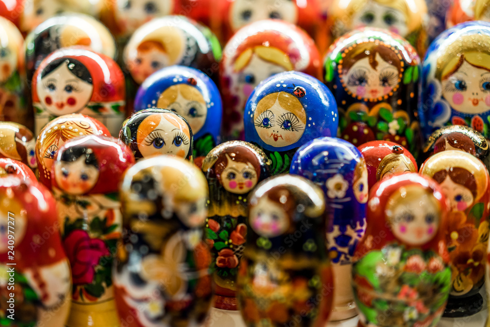 Nesting wooden dolls. Colorful Russian matryoshka at the souvenirs market