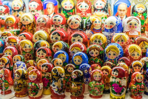 Nesting wooden dolls. Colorful Russian matryoshka at the souvenirs market