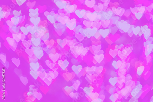 Shaped hearts abstract with bokeh defocused lights on pink background.