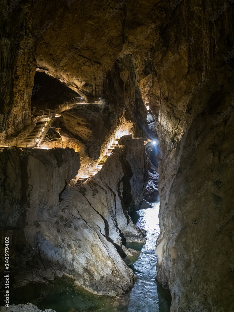 Illuminated path above the canyon in Skocjanske jame cave