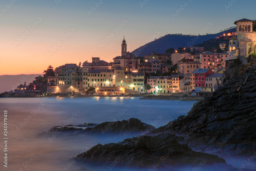 Obraz premium Night view of Bogliasco village with coastal rocks