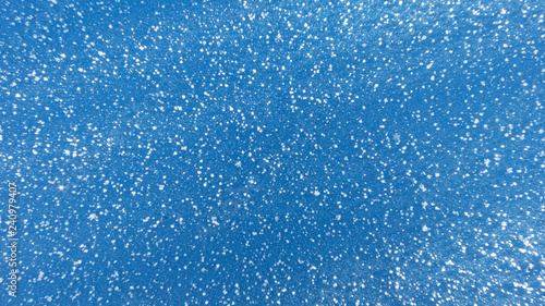 snow on blue background