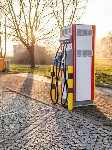 Electric Vehicle charger on highway parking lot future of personal transportation and refueling