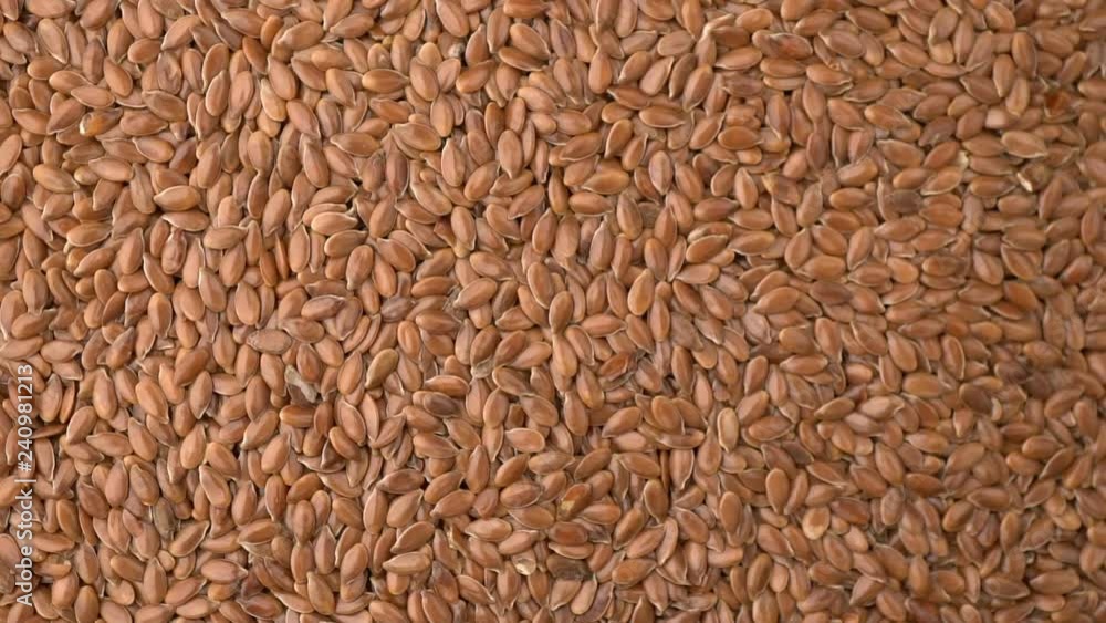 many flax seeds rotating background many flax seeds rotating background
