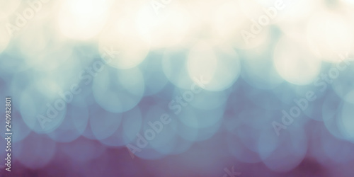 Bokeh blur abstract background blurry light glowing illumination in cool teal blue green color 