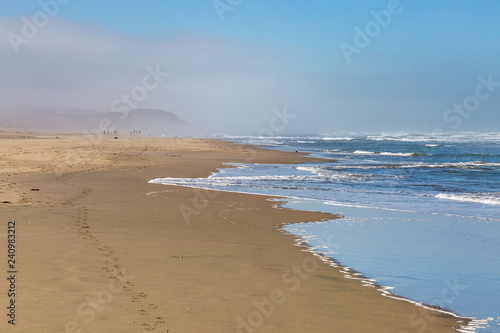 A misty Ocean Beach in San Francisco  on a summer s morning