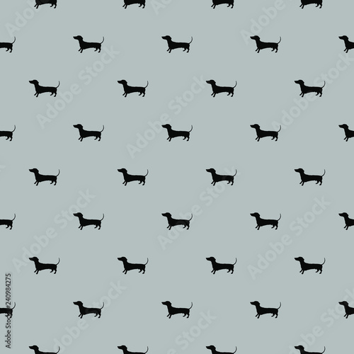 Seamless pattern of vector hand drawn doodle illustration of badger dog silhouette on solid grey background. Product surface design clothes textile fabric prints bed linen pillows gift wrapping paper © indaflesh