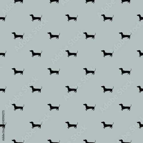 Seamless pattern of vector hand drawn doodle illustration of badger dog silhouette on solid grey background. Product surface design clothes textile fabric prints bed linen pillows gift wrapping paper