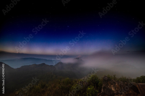 Stars on the top of a mountain covered with fog