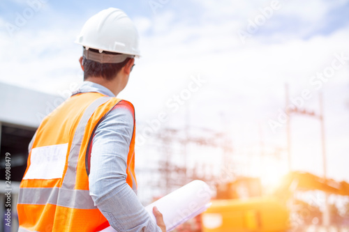 Asiatic engineers are work inspecting the electric building