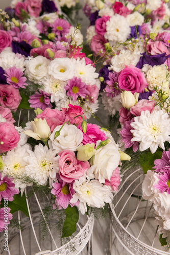Wallpaper Mural Various bridal flower heads in vintage ornate bird cage as bloom decoration at a wedding reception Torontodigital.ca