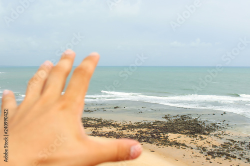 hand on the beach