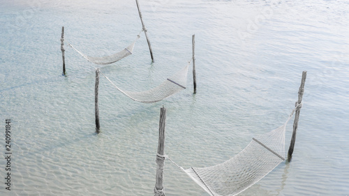 White rope cradle on relaxing beach, summer vacation concept, Aerial view.