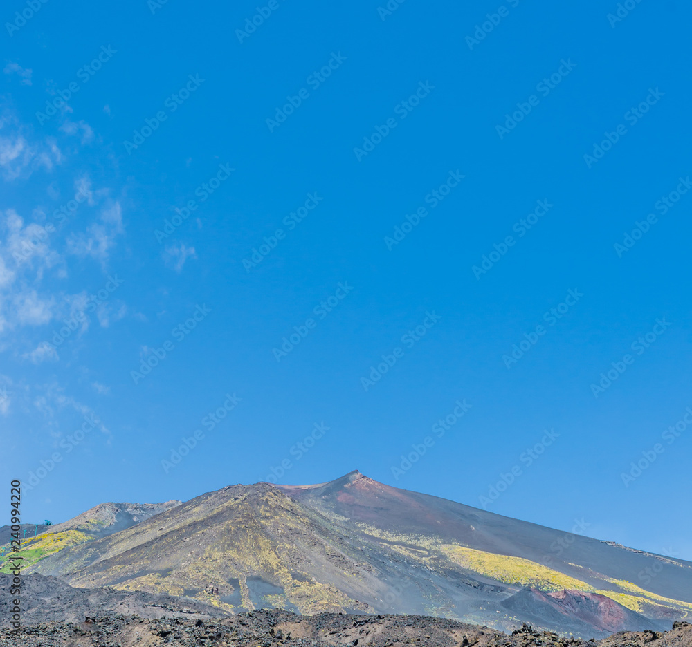 Scenic view of the volcano Etna on a background blue sky. Europe's highest volcano still in activity.