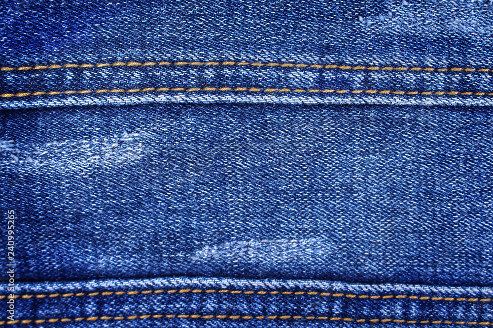 Blue denim texture with double thread sewing patterns , jeans fabric for background Blue denim texture with double thread sewing patterns , jeans fabric for background