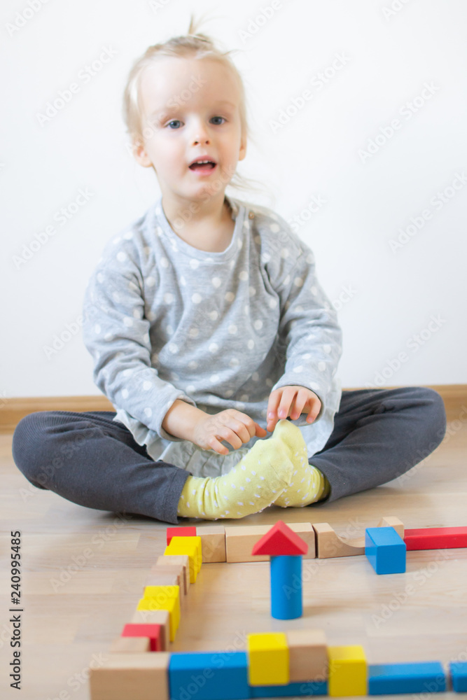 Caucasian Girl Playing with Wooden Colorful Cubes at Home Early Education Preparing for School Development Caucasian Girl Playing with Wooden Colorful Cubes at Home Early Education Preparing for School Development