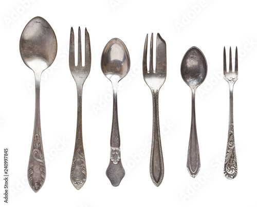 Vintage tea spoons and forks isolated on a white background. Retro silverware