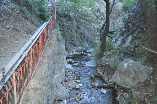 The beautiful millomeris waterfalls in the forest in Cyprus photo