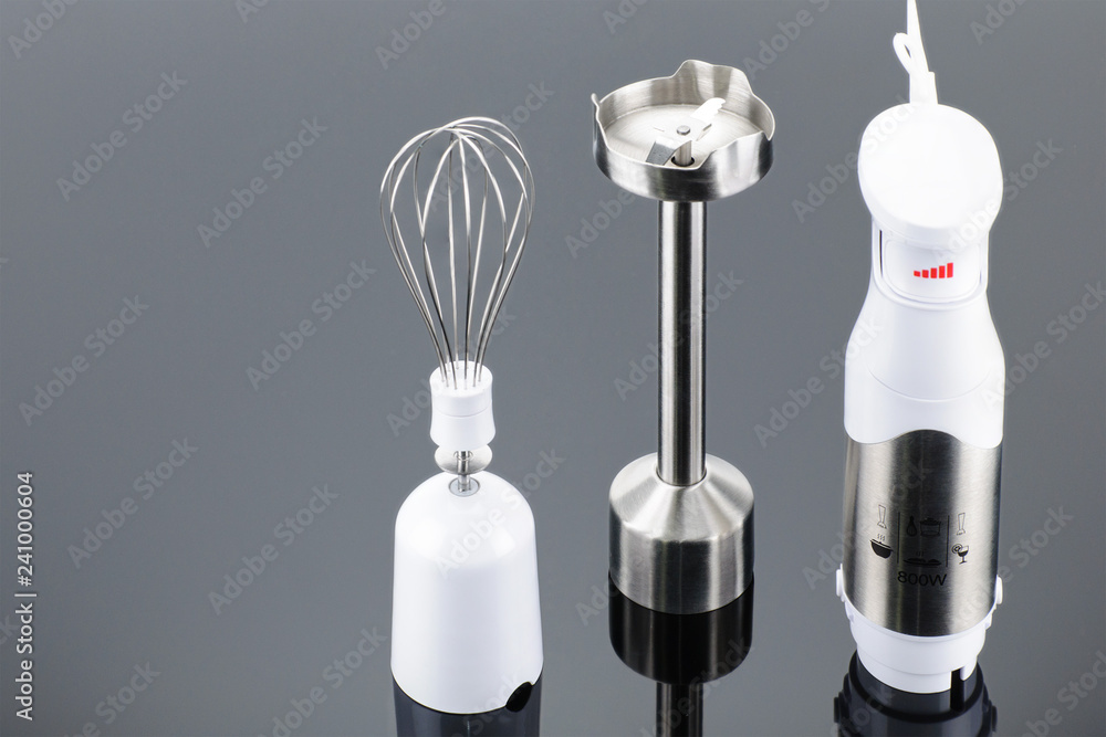 Blender with accessory on the grey mirror background with copy space Blender with accessory on the grey mirror background with copy space