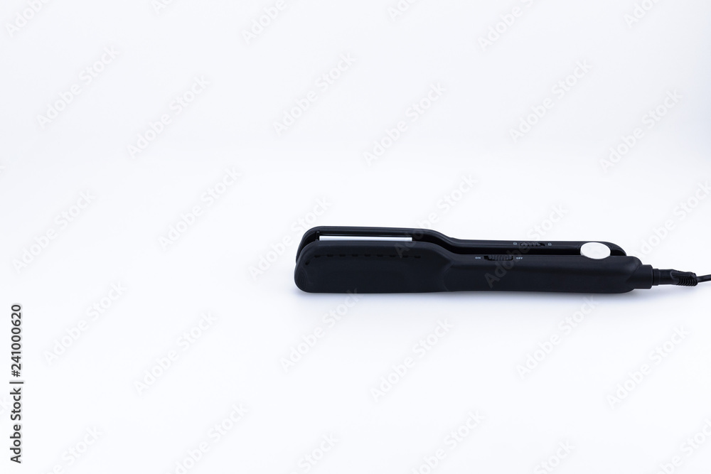 Grey hair iron on the white background with copy space. Grey hair iron on the white background with copy space.