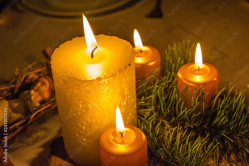 Christmas wreath with burning candles