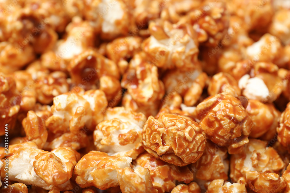 Sweet tasty caramel popcorn as background, closeup Sweet tasty caramel popcorn as background, closeup