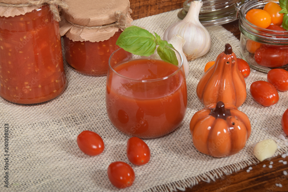cocktail tomatoes, garlic, spices, colorful pumpkins and scattered kitchen salt cocktail tomatoes, garlic, spices, colorful pumpkins and scattered kitchen salt