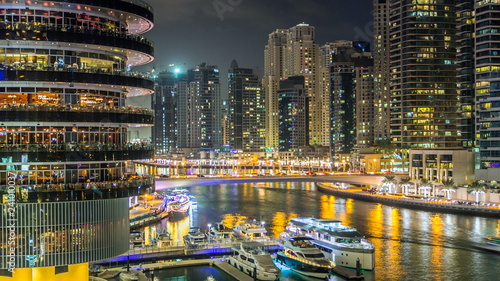 Photography View of Dubai Marina Towers and canal in Dubai night timelapse