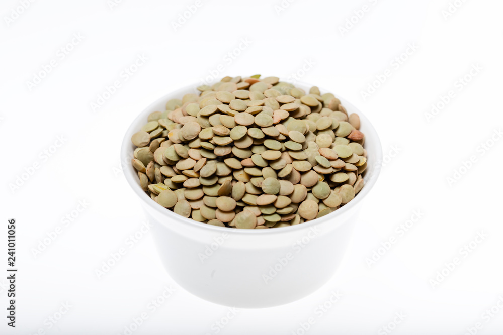 Bowl of green lentil on white background Bowl of green lentil on white background