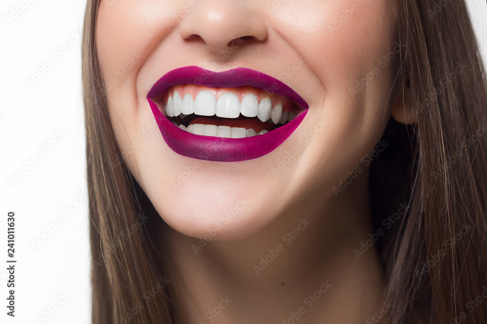Fototapeta premium Perfect smile after bleaching. Dental care and whitening teeth. Stomatology and beauty care. Woman smiling with great teeth. Cheerful female smile with fresh clear skin and pink lips