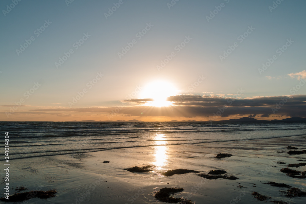 Sunset Beach View With Mountains And Clouds Sunset Beach View With Mountains And Clouds